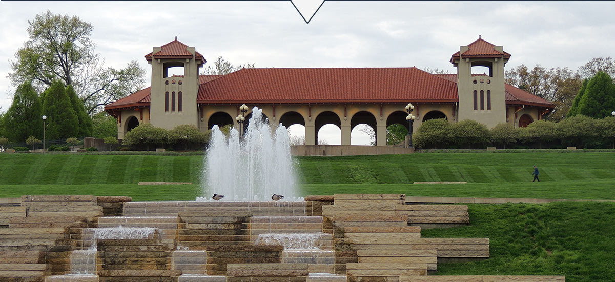 World’s Fair Pavilion with ducks standing on cascading fountain in foreground.